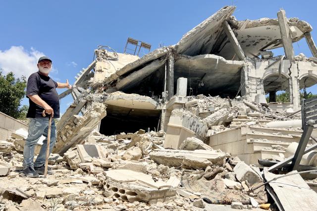 (260727) -- ZAWTAR AL, July 27, 2026 (Xinhua) -- A resident inspects a damaged house in Zawtar al-Gharbiyah, southern Lebanon, July 26, 2026. The Lebanese army said Sunday that continued Israeli attacks and violations of existing understandings are obstructing its deployment in southern Lebanon and delaying the return of residents to their border villages. (Photo by Ali Hashisho/Xinhua)