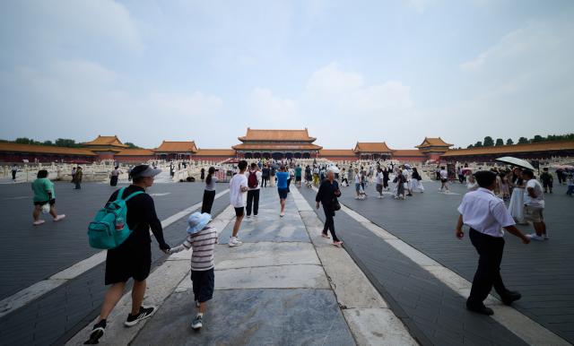 (260727) -- BEIJING, July 27, 2026 (Xinhua) -- People visit the Palace Museum in Beijing, capital of China, July 27, 2026. Marking the second anniversary of the successful inscription of the Beijing Central Axis on the UNESCO World Heritage List, heritage sites along the central axis, such as the Palace Museum, Zhengyangmen Gate, and Altar of the God of Agriculture, also referred to as the Xiannongtan Temple, were opened to the public, and some sites launched new exhibitions on Monday.
   Stretching 7.8 kilometers from Yongding Gate in the south to the Drum and Bell Towers in the north, the Beijing Central Axis was constructed based on ancient architectural philosophies to create an ideal layout for a capital city. The Central Axis can be traced back to the early Yuan Dynasty (1271-1368), and its length was extended in the Ming and Qing dynasties. (Xinhua/Li Xin)
