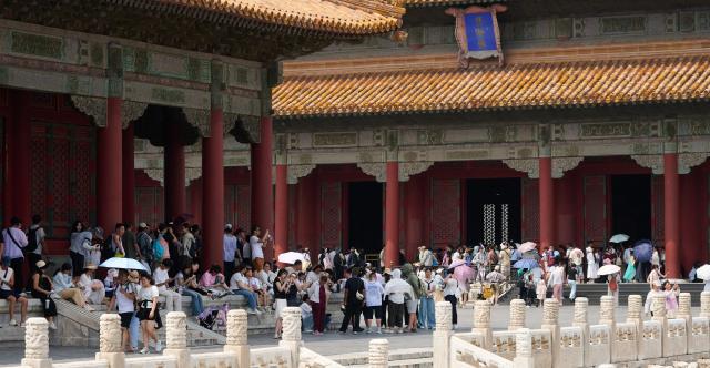 (260727) -- BEIJING, July 27, 2026 (Xinhua) -- People visit the Palace Museum in Beijing, capital of China, July 27, 2026. Marking the second anniversary of the successful inscription of the Beijing Central Axis on the UNESCO World Heritage List, heritage sites along the central axis, such as the Palace Museum, Zhengyangmen Gate, and Altar of the God of Agriculture, also referred to as the Xiannongtan Temple, were opened to the public, and some sites launched new exhibitions on Monday.
   Stretching 7.8 kilometers from Yongding Gate in the south to the Drum and Bell Towers in the north, the Beijing Central Axis was constructed based on ancient architectural philosophies to create an ideal layout for a capital city. The Central Axis can be traced back to the early Yuan Dynasty (1271-1368), and its length was extended in the Ming and Qing dynasties. (Xinhua/Li Xin)