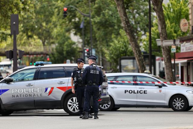 (260727) -- PARIS, July 27, 2026 (Xinhua) -- Policemen and police vehicles are seen near the site of a knife attack in Paris, France, July 27, 2026. Three people were injured in a knife attack in Paris on Monday, and a male suspect was arrested.
   The attack occurred at around 11:30 a.m. local time in northwestern Paris, where a man armed with two kitchen knives attacked passersby on the street. The victims received medical treatment, with two of them in critical condition, according to French media reports. (Xinhua/Wu Huiwo)
