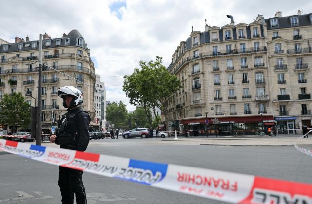(260727) -- PARIS, July 27, 2026 (Xinhua) -- A policeman stands guard near the site of a knife attack in Paris, France, July 27, 2026. Three people were injured in a knife attack in Paris on Monday, and a male suspect was arrested.
   The attack occurred at around 11:30 a.m. local time in northwestern Paris, where a man armed with two kitchen knives attacked passersby on the street. The victims received medical treatment, with two of them in critical condition, according to French media reports. (Xinhua/Wu Huiwo)