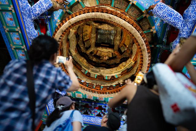 (260727) -- BEIJING, July 27, 2026 (Xinhua) -- People visit the Beijing Ancient Architecture Museum inside the Altar of the God of Agriculture, also referred to as the Xiannongtan Temple, in Beijing, capital of China, July 27, 2026. The second anniversary of the inscription of the Beijing Central Axis on the UNESCO World Heritage List falls on July 27.
   Since its inscription, the 7.8-kilometer-long axis has continued to gain new vitality, attracting more visitors to experience Beijing's historical heritage amid the blend of ancient architecture and modern life, while bringing World Heritage closer to everyday life.
   Stretching from the Bell and Drum Towers in the north to Yongdingmen Gate in the south, the Beijing Central Axis reflects traditional Chinese urban planning and serves as the spatial backbone of the old city. Carrying the history of Beijing's urban development, it bears witness to the continuity of Chinese civilization and reflects the capital's evolution through the ages. (Xinhua/Zhang Xiaoyu)