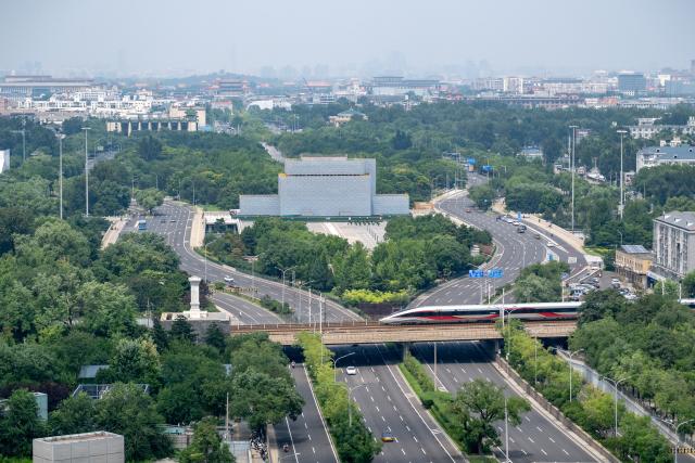 (260727) -- BEIJING, July 27, 2026 (Xinhua) -- This photo taken on July 27, 2026 shows a view of the Yongdingmen Gate under renovation in Beijing, capital of China. The systemic renovation of the Yongdingmen Gate started in October 2025. The second anniversary of the inscription of the Beijing Central Axis on the UNESCO World Heritage List falls on July 27.
   Since its inscription, the 7.8-kilometer-long axis has continued to gain new vitality, attracting more visitors to experience Beijing's historical heritage amid the blend of ancient architecture and modern life, while bringing World Heritage closer to everyday life.
   Stretching from the Bell and Drum Towers in the north to Yongdingmen Gate in the south, the Beijing Central Axis reflects traditional Chinese urban planning and serves as the spatial backbone of the old city. Carrying the history of Beijing's urban development, it bears witness to the continuity of Chinese civilization and reflects the capital's evolution through the ages. (Xinhua/Hu Jingwen)