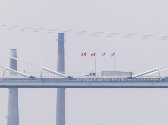 (260727) -- WINDSOR(CANADA), July 27, 2026 (Xinhua) -- A truck heading into Canada on the Gordie Howe International Bridge is pictured from the Canadian side in Windsor, Ontario, Canada, on July 27, 2026. Canada on Monday opened a new international bridge linking Windsor, Ontario and Detroit, U.S., providing the newest and largest land border crossing with the United States despite escalating trade tensions between the two countries. (Photo by Zou Zheng/Xinhua)