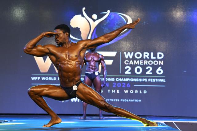 (260728) -- YAOUNDE, July 28, 2026 (Xinhua) -- An athlete flexes his muscles during the World Fitness and Bodybuilding Championships Festival in Yaounde, Cameroon, on July 27, 2026. (Xinhua/Kepseu)