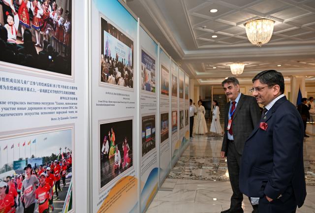 (260727) -- BISHKEK, July 27, 2026 (Xinhua) -- Guests visit a photo exhibition titled "Pooling the Strength of the SCO: Moving Toward Development and Prosperity" in Bishkek, Kyrgyzstan, July 27, 2026.
  A photo exhibition marking the 25th anniversary of the Shanghai Cooperation Organization (SCO) opened here on Monday.
  The exhibition features 32 photographs arranged in five sections: "A Shared Journey Over 25 Years," "Strengthening the Foundation for Safeguarding Peace," "Shared Prosperity: Unlocking New Opportunities," "Bridges Between Hearts: A Shared Future," and "A New Chapter for a Community with a Shared Future."
  Jointly organized by the SCO Secretariat and Xinhua News Agency, the exhibition showcases the organization's practical cooperation over the past quarter-century while capturing moments that reflect the growing friendship among the peoples of countries participating in the SCO framework. (Xinhua/Feng Kaihua)