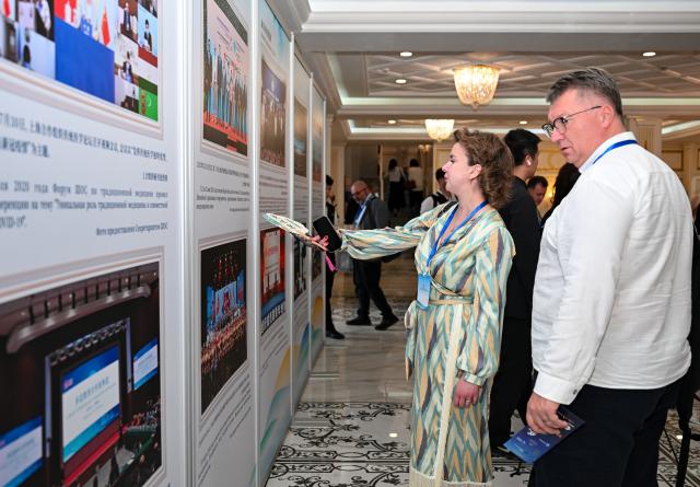 (260727) -- BISHKEK, July 27, 2026 (Xinhua) -- Guests visit a photo exhibition titled "Pooling the Strength of the SCO: Moving Toward Development and Prosperity" in Bishkek, Kyrgyzstan, July 27, 2026.
  A photo exhibition marking the 25th anniversary of the Shanghai Cooperation Organization (SCO) opened here on Monday.
  The exhibition features 32 photographs arranged in five sections: "A Shared Journey Over 25 Years," "Strengthening the Foundation for Safeguarding Peace," "Shared Prosperity: Unlocking New Opportunities," "Bridges Between Hearts: A Shared Future," and "A New Chapter for a Community with a Shared Future."
  Jointly organized by the SCO Secretariat and Xinhua News Agency, the exhibition showcases the organization's practical cooperation over the past quarter-century while capturing moments that reflect the growing friendship among the peoples of countries participating in the SCO framework. (Xinhua/Feng Kaihua)