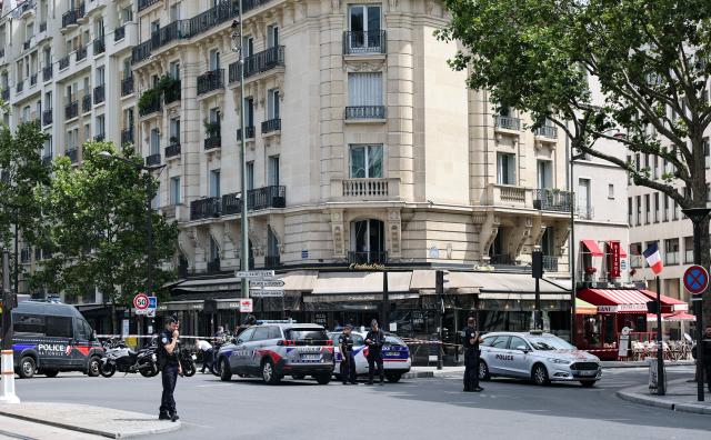 (260728) -- BEIJING, July 28, 2026 (Xinhua) -- Policemen and police vehicles are seen near the site of a knife attack in Paris, France, July 27, 2026. Three people were injured in a knife attack in Paris on Monday, and a male suspect was arrested.
   The attack occurred at around 11:30 a.m. local time in northwestern Paris, where a man armed with two kitchen knives attacked passersby on the street. The victims received medical treatment, with two of them in critical condition, according to French media reports. (Xinhua/Wu Huiwo)