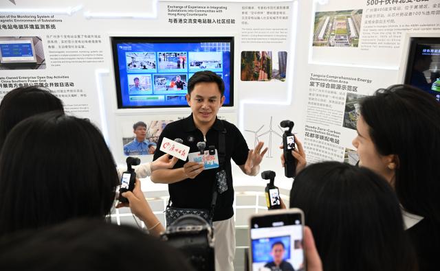 (260728) -- GUANGZHOU, July 28, 2026 (Xinhua) -- A social media influencer from Myanmar receives an interview at a science popularization center of a substation under China Southern Power Grid Co., Ltd. in Guangzhou, south China's Guangdong Province, July 27, 2026.
  Over 20 journalists and social media influencers from ASEAN countries started their visit tour in Guangdong on Monday.
  This year marks the fifth anniversary of the establishment of the China-ASEAN Comprehensive Strategic Partnership. (Xinhua/Deng Hua)