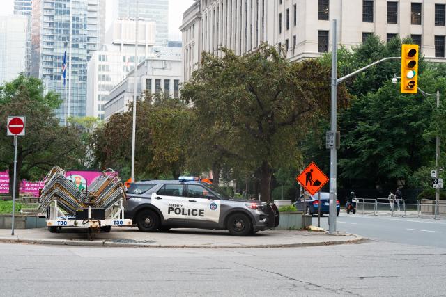 (260728) -- TORONTO, July 28, 2026 (Xinhua) -- A police vehicle is seen near the U.S. Consulate in downtown Toronto, Canada, July 27, 2026. The U.S. Consulate in downtown Toronto was targeted in a shooting early Monday morning, marking the second time this year the building has been attacked, according to local media reports. (Photo by Li Haitao/Xinhua)