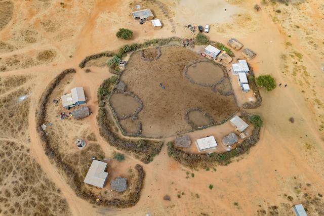(260728) -- KAJIADO, July 28, 2026 (Xinhua) -- An aerial drone photo taken on July 22, 2026 shows a Maasai village at southern Amboseli in Kajiado County, Kenya. TO GO WITH "Feature: All-female rangers boost wildlife conservation efforts in Kenya's Amboseli" (Xinhua/Xie Jianfei)