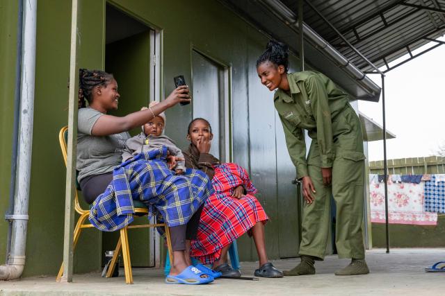(260728) -- KAJIADO, July 28, 2026 (Xinhua) -- Members of Team Lioness talk at a camp in Ole Narika conservancy in Kajiado County, Kenya, July 22, 2026. TO GO WITH "Feature: All-female rangers boost wildlife conservation efforts in Kenya's Amboseli" (Xinhua/Xie Jianfei)