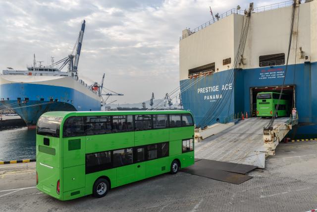 (260728) -- YANTAI, July 28, 2026 (Xinhua) -- A drone photo taken on July 27, 2026 shows homemade electric double-decker buses heading to a car carrier at Yantai Port in Yantai, east China's Shandong Province. A total of 35 Chinese bus maker Yutong's U11DD electric double-decker buses on Monday were shipped from the Yantai Port to Britain. The type of bus, designed specifically for the European markets, has been put into service in London's public transport system. (Photo by Zhang Chao/Xinhua)