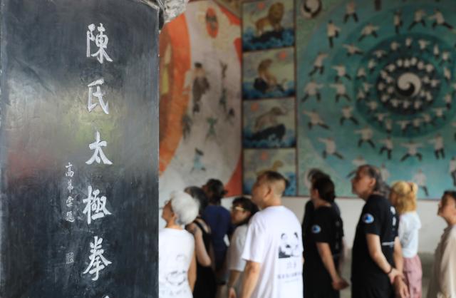 (260728) -- ZHENGZHOU, July 28, 2026 (Xinhua) -- Foreign enthusiasts of Tai Chi visit an ancestral hall to learn about Tai Chi culture in Chenjiagou in Wenxian County, central China's Henan Province, July 27, 2026. This summer, numerous foreign enthusiasts of Tai Chi visited Chenjiagou, a small village in Henan Province where Tai Chi originated, to practice Tai Chi and experience Chinese martial arts culture.
  Rooted in Chinese philosophy, traditional medicine and martial arts, Tai Chi has evolved into a wide range of styles and is now practiced in more than 180 countries and regions, with hundreds of millions of practitioners worldwide. (Photo by Huang Fuxing/Xinhua)