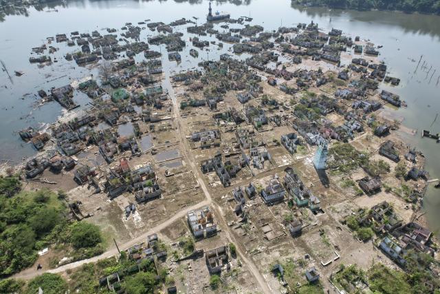 (260728) -- LEBAK, July 28, 2026 (Xinhua) -- An aerial drone photo taken on July 28, 2026 shows remains of houses re-emerging as the reservoir's water level drops in Lebak regency, Banten province, Indonesia. Due to the impact of El Nino, the dry season in Indonesia has been more intense and prolonged this year, with heightened risks of wildfires and droughts. (Xinhua/Veri Sanovri)