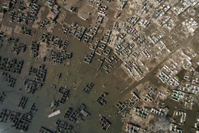 (260728) -- LEBAK, July 28, 2026 (Xinhua) -- An aerial drone photo taken on July 28, 2026 shows remains of houses re-emerging as the reservoir's water level drops in Lebak regency, Banten province, Indonesia. Due to the impact of El Nino, the dry season in Indonesia has been more intense and prolonged this year, with heightened risks of wildfires and droughts. (Xinhua/Veri Sanovri)