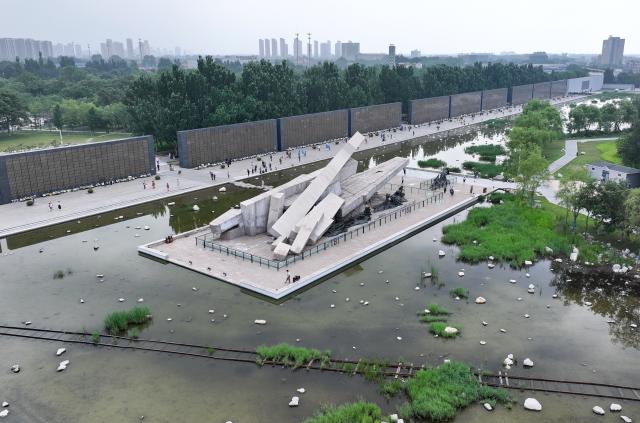 (260728) -- TANGSHAN, July 28, 2026 (Xinhua) -- An aerial drone photo taken on July 27, 2026 shows people visiting the Tangshan Earthquake Memorial Park in Tangshan, north China's Hebei Province. This year marks the 50th anniversary of the Tangshan Earthquake, a magnitude-7.8 quake that struck the city on July 28, 1976, taking the lives of more than 240,000 people and destroying virtually all buildings in the city.
   Crowds of people visited the Tangshan Earthquake Memorial Park on Tuesday to mourn and remember the victims in the devastating disaster. (Xinhua/Yang Shiyao)