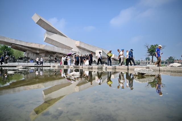 (260728) -- TANGSHAN, July 28, 2026 (Xinhua) -- People visit the Tangshan Earthquake Memorial Park in Tangshan, north China's Hebei Province, July 28, 2026. This year marks the 50th anniversary of the Tangshan Earthquake, a magnitude-7.8 quake that struck the city on July 28, 1976, taking the lives of more than 240,000 people and destroying virtually all buildings in the city.
   Crowds of people visited the Tangshan Earthquake Memorial Park on Tuesday to mourn and remember the victims in the devastating disaster. (Xinhua/Mu Yu)