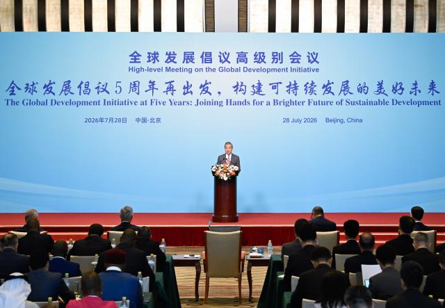 (260728) -- BEIJING, July 28, 2026 (Xinhua) -- Chinese Foreign Minister Wang Yi, also a member of the Political Bureau of the Communist Party of China Central Committee, attends the High-level Meeting on the Global Development Initiative (GDI) and delivers remarks in Beijing, capital of China, July 28, 2026. (Xinhua/Shen Hong)