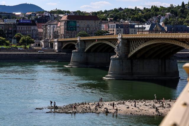 (260728) -- BUDAPEST, July 28, 2026 (Xinhua) -- Photo taken on July 28, 2026 shows the Danube River with its partially exposed riverbed in Budapest, Hungary. The water level of the Danube River in Budapest fell to a record low of 31 centimeters on Tuesday, according to Hungary's General Directorate of Water Management. The reading surpassed the previous record low of 33 centimeters which was measured on October 25, 2018, as prolonged drought and a lack of rainfall continue to affect much of the region. (Photo by David Balogh/Xinhua)