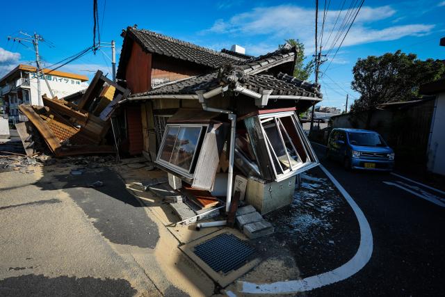 (260729) -- KUMAMOTO, July 29, 2026 (Xinhua) -- This photo taken on July 29, 2026 shows a damaged house after an earthquake in Kumamoto Prefecture, Japan. Twelve people have been confirmed dead following a powerful earthquake that struck Kumamoto Prefecture, southwestern Japan, while six others remain in cardiac arrest, local media reported Wednesday, citing the latest official figures.
   Speaking at a disaster response headquarters meeting held shortly after 4:00 p.m. local time, prefectural officials said that 62 people had also been injured, while at least four people remain unaccounted for, public broadcaster NHK reported. (Xinhua/Jia Haocheng)