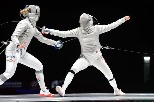 (260729) -- HONG KONG, July 29, 2026 (Xinhua) -- Battai Sugar Katinka (L) of Hungary competes with Pan Qimiao of China during the women's team sabre final between China and Hungary at the 2026 Fencing World Championships in Hong Kong, south China, July 29, 2026. (Xinhua/Lo Ping Fai)