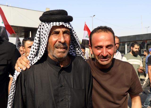 (260729) -- BAGHDAD, July 29, 2026 (Xinhua) -- People participate in a funeral procession of killed Popular Mobilization Forces (PMF) members in Baghdad, Iraq, on July 29, 2026. Iraq's PMF said Wednesday that at least 20 of its members were killed and 32 others wounded during the U.S.-Saudi strikes across several Iraqi provinces. (Xinhua/Khalil Dawood)