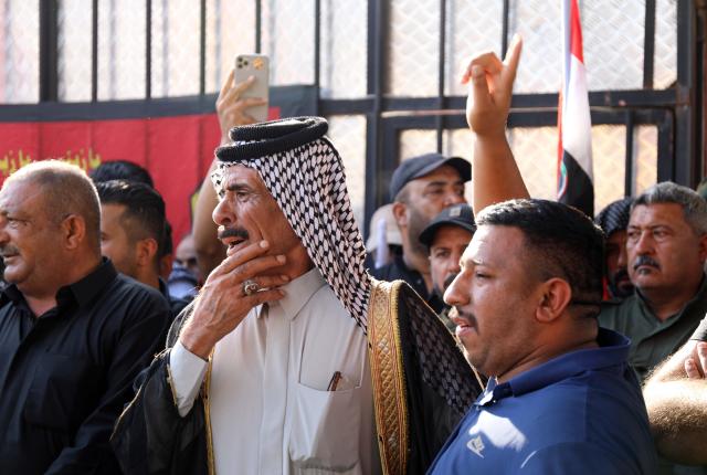 (260729) -- BAGHDAD, July 29, 2026 (Xinhua) -- People participate in a funeral procession of killed Popular Mobilization Forces (PMF) members in Baghdad, Iraq, on July 29, 2026. Iraq's PMF said Wednesday that at least 20 of its members were killed and 32 others wounded during the U.S.-Saudi strikes across several Iraqi provinces. (Xinhua/Khalil Dawood)