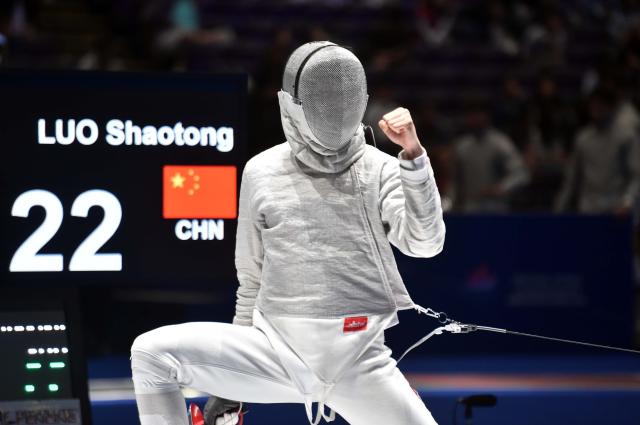 (260730) -- HONG KONG, July 30, 2026 (Xinhua) -- Luo Shaotong of China celebrates a point during the team men's sabre quarterfinal match between China and France at the 2026 Fencing World Championships in Hong Kong, south China, July 30, 2026. (Xinhua/Lo Ping Fai)