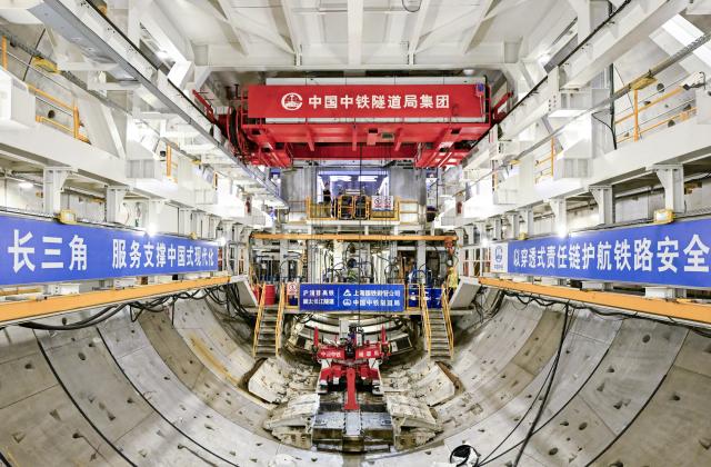 (260730) -- SHANGHAI, July 30, 2026 (Xinhua) -- This photo taken on July 30, 2026 shows a view of the shield tunneling machine "Linghang" at the construction site of the Chongming-Taicang Yangtze River tunnel under China's Yangtze River. China's domestically developed, world's largest-diameter high-speed-rail shield tunneling machine "Linghang" completed tunneling of the underwater section of the Chongming-Taicang Yangtze River tunnel on Thursday. The milestone lays the foundation for China's first high-speed railway crossing beneath the Yangtze River at 350 kilometers per hour without slowing down. (Xinhua/Chen Haoming)