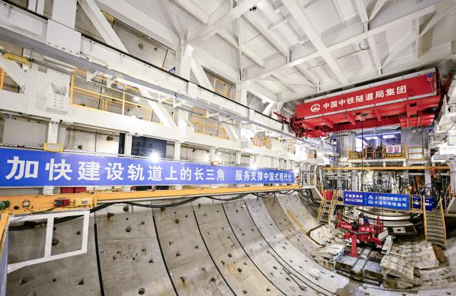 (260730) -- SHANGHAI, July 30, 2026 (Xinhua) -- This photo taken on July 30, 2026 shows a view of the shield tunneling machine "Linghang" at the construction site of the Chongming-Taicang Yangtze River tunnel under China's Yangtze River. China's domestically developed, world's largest-diameter high-speed-rail shield tunneling machine "Linghang" completed tunneling of the underwater section of the Chongming-Taicang Yangtze River tunnel on Thursday. The milestone lays the foundation for China's first high-speed railway crossing beneath the Yangtze River at 350 kilometers per hour without slowing down. (Xinhua/Chen Haoming)