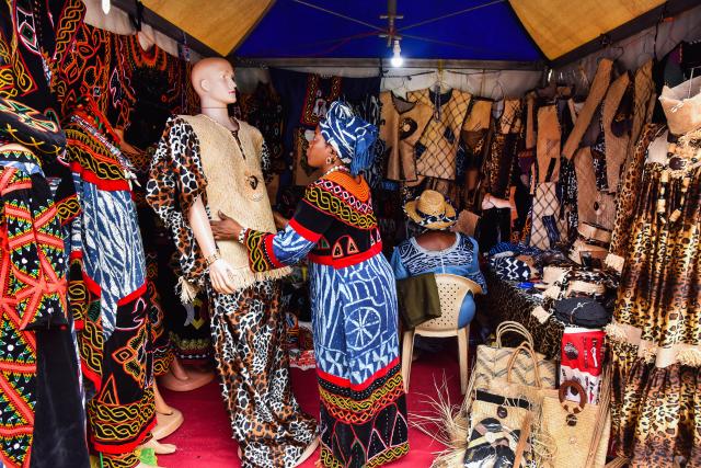 (260730) -- YAOUNDE, July 30, 2026 (Xinhua) -- A clothing artisan exhibits her original creations during a handicraft exhibition in Yaounde, Cameroon, July 29, 2026. The 9th International Handicraft Exhibition of Cameroon opened on Monday in the country's capital, Yaounde, bringing together artisans from across the country and abroad.
  TO GO WITH "Cameroon kicks off 9th int'l handicraft exhibition to boost local innovation" (Xinhua/Kepseu)