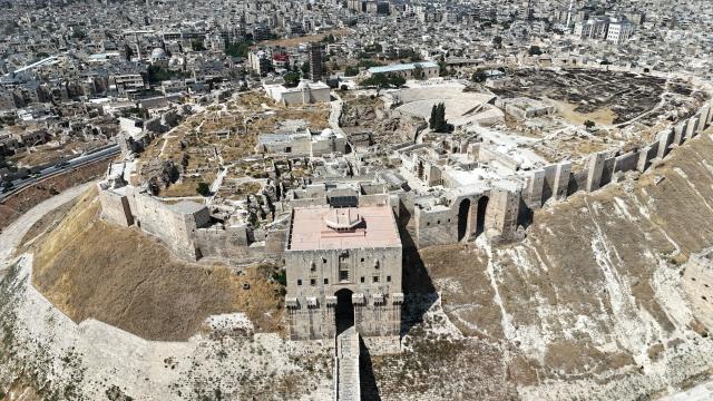 (260730) -- ALEPPO, July 30, 2026 (Xinhua) -- An aerial drone photo taken on July 20, 2026 shows a general view of Aleppo Citadel in Aleppo, Syria. TO GO WITH "Feature: At Aleppo Citadel, every stone tells two stories: one of empire, one of survival" (Photo by Monsef Memari/Xinhua)