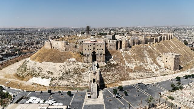 (260730) -- ALEPPO, July 30, 2026 (Xinhua) -- An aerial drone photo taken on July 20, 2026 shows a general view of Aleppo Citadel in Aleppo, Syria. TO GO WITH "Feature: At Aleppo Citadel, every stone tells two stories: one of empire, one of survival" (Photo by Monsef Memari/Xinhua)