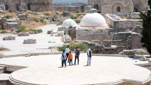 (260730) -- ALEPPO, July 30, 2026 (Xinhua) -- People visit Aleppo Citadel in Aleppo, Syria, July 20, 2026. TO GO WITH "Feature: At Aleppo Citadel, every stone tells two stories: one of empire, one of survival" (Photo by Monsef Memari/Xinhua)