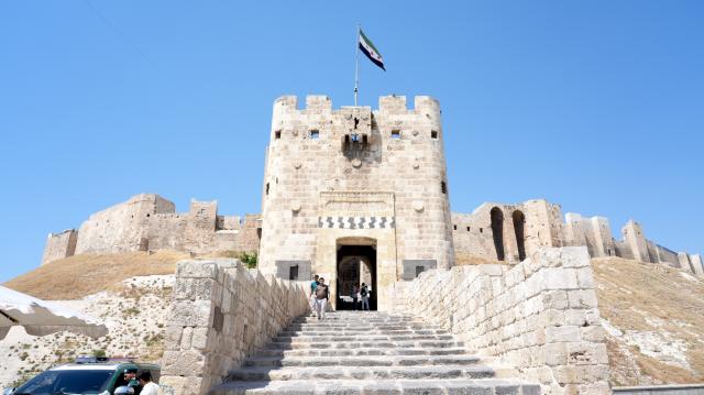 (260730) -- ALEPPO, July 30, 2026 (Xinhua) -- This photo taken on July 20, 2026 shows the main entrance to Aleppo Citadel in Aleppo, Syria. TO GO WITH "Feature: At Aleppo Citadel, every stone tells two stories: one of empire, one of survival" (Photo by Monsef Memari/Xinhua)