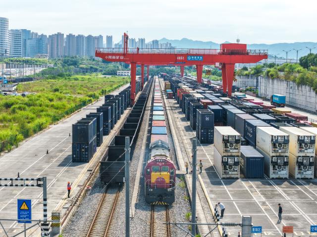(260731) -- CHONGQING, July 31, 2026 (Xinhua) -- An aerial drone photo taken on July 30, 2026 shows a freight train of the New International Land-Sea Trade Corridor waiting for departure at Yuzui Station in Chongqing, southwest China. A total of 961 rail freight train trips were operated from Chongqing via the New International Land-Sea Trade Corridor in the first half of the year, up 25.6 percent year on year, according to the logistics division of China Railway Chengdu Group Co., Ltd. 
  Chongqing's imports and exports via the corridor amounted to 28.71 billion yuan (about 4.25 billion U.S. dollars) during the same period, rising 13.7 percent year on year, according to data from Chongqing Customs. (Xinhua/Tang Yi)