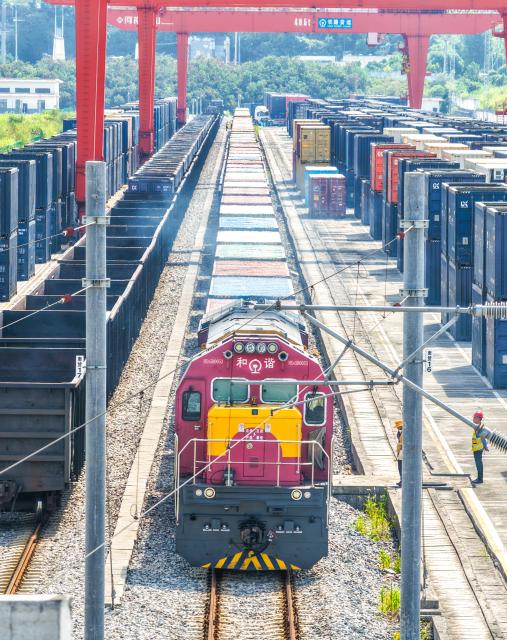 (260731) -- CHONGQING, July 31, 2026 (Xinhua) -- An aerial drone photo taken on July 30, 2026 shows a freight train of the New International Land-Sea Trade Corridor waiting for departure at Yuzui Station in Chongqing, southwest China. A total of 961 rail freight train trips were operated from Chongqing via the New International Land-Sea Trade Corridor in the first half of the year, up 25.6 percent year on year, according to the logistics division of China Railway Chengdu Group Co., Ltd. 
  Chongqing's imports and exports via the corridor amounted to 28.71 billion yuan (about 4.25 billion U.S. dollars) during the same period, rising 13.7 percent year on year, according to data from Chongqing Customs. (Xinhua/Tang Yi)