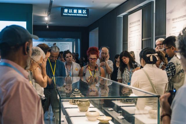 (260731) -- JINGDEZHEN, July 31, 2026 (Xinhua) -- Brazilian artist Viviane Diehl (C) visits China Ceramics Museum in Jingdezhen, east China's Jiangxi Province, June 28, 2026. TO GO WITH "Feature: Brazilian artist achieves dreams in China's 'porcelain capital'" (Xinhua)