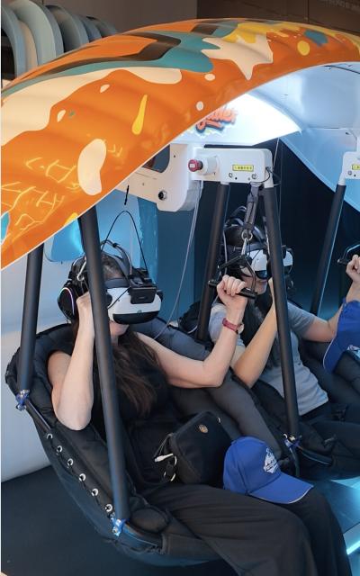 (260731) -- JINGMEN, July 31, 2026 (Xinhua) -- Foreign journalists explore virtual-reality paragliding in Jingmen, central China's Hubei Province, July 23, 2026. TO GO WITH "Across China: Courts and clouds: A new playbook for growth in China's Hubei" (Xinhua/Yu Xi)