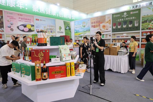 (260731) -- TIANJIN, July 31, 2026 (Xinhua) -- An exhibitor promotes products via livestreaming during the 2026 China (Tianjin) Investment and Trade Fair, held on the sideline of the 2026 Haihe International Consumption Forum, in Tianjin, north China, July 30, 2026.
  The 2026 Haihe International Consumption Forum kicked off here on Thursday, featuring key topics on unleashing the potential of domestic demand, upgrading the service industry, as well as innovating consummer business formats and scenarios.
  The 2026 China (Tianjin) Investment and Trade Fair was held on the sideline of the forum, showcasing premium products and industrial resources from home and abroad. (Xinhua/Li Ran)