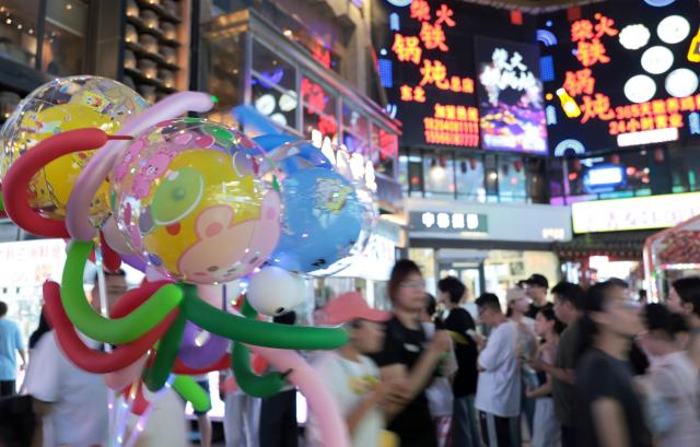 (260731) -- SHENYANG, July 31, 2026 (Xinhua) -- People visit the Xita neighborhood in Shenyang, northeast China's Liaoning Province, July 29, 2026. Xita is a distinctive neighborhood in Shenyang which is known for its wide variety of local specialties and attracts visitors from across the country. (Xinhua/Li Gang)
