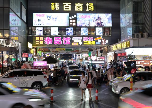 (260731) -- SHENYANG, July 31, 2026 (Xinhua) -- People visit the Xita neighborhood in Shenyang, northeast China's Liaoning Province, July 29, 2026. Xita is a distinctive neighborhood in Shenyang which is known for its wide variety of local specialties and attracts visitors from across the country. (Xinhua/Li Gang)
