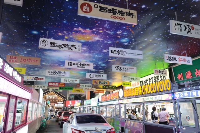 (260731) -- SHENYANG, July 31, 2026 (Xinhua) -- This photo taken on July 29, 2026 shows a view of the Xita neighborhood in Shenyang, northeast China's Liaoning Province. Xita is a distinctive neighborhood in Shenyang which is known for its wide variety of local specialties and attracts visitors from across the country. (Xinhua/Li Gang)
