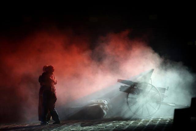(260731) -- YAN'AN, July 31, 2026 (Xinhua) -- Actors perform a revolutionary-themed immersive drama in Yan'an, northwest China's Shaanxi Province, on July 28, 2026. During the summer vacation, Yan'an, an old revolutionary base, has seen a surge in tourists, with its revolutionary sites and performances continuing to attract visitors. (Xinhua/Li Yibo)
