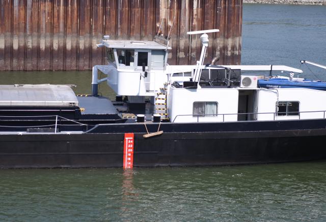 (260731) -- VIENNA, July 31, 2026 (Xinhua) -- A cargo vessel is seen on the Danube River in Vienna, Austria, July 31, 2026. A new round of extreme heat is tightening its grip on Europe from the Mediterranean to Scandinavia, setting local temperature records and fueling wildfires, violent storms and growing safety risks. Weeks of scorching temperatures and scarce rainfall have also pushed major rivers to historic lows, disrupting shipping, industry and agriculture, while forecasters warn another heat surge could arrive around the turn of the month. (Xinhua/He Canling)