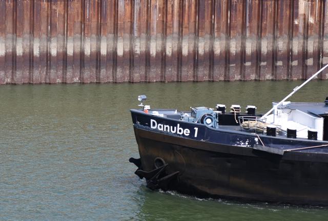 (260731) -- VIENNA, July 31, 2026 (Xinhua) -- A cargo vessel is seen on the Danube River in Vienna, Austria, July 31, 2026. A new round of extreme heat is tightening its grip on Europe from the Mediterranean to Scandinavia, setting local temperature records and fueling wildfires, violent storms and growing safety risks. Weeks of scorching temperatures and scarce rainfall have also pushed major rivers to historic lows, disrupting shipping, industry and agriculture, while forecasters warn another heat surge could arrive around the turn of the month. (Xinhua/He Canling)