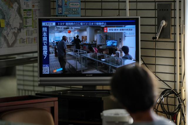 (260731) -- KUMAMOTO, July 31, 2026 (Xinhua) -- A resident watches TV at a shelter in Kumamoto Prefecture, Japan, July 30, 2026. The death toll from a powerful earthquake that struck Japan's Kumamoto Prefecture has risen to 35, the prefectural government said Friday. (Xinhua/Jia Haocheng)