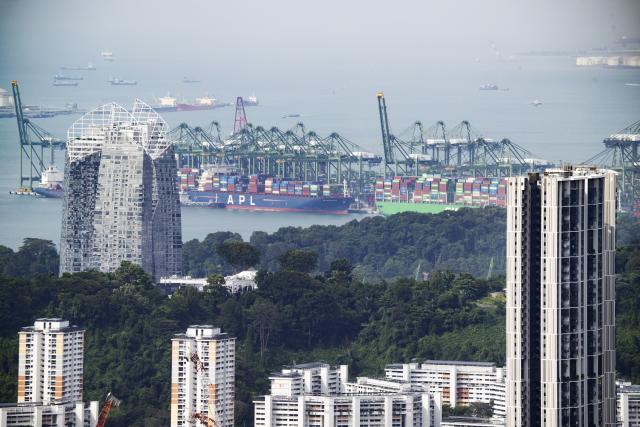 (260731) -- SINGAPORE, July 31, 2026 (Xinhua) -- This file photo taken on Jan. 14, 2026 shows a port in Singapore. The World Trade Organization (WTO) releases the latest data on July 31, 2026, which showed that global merchandise trade growth exceeded expectations in the first quarter of 2026, as surging trade in electronic components related to artificial intelligence (AI) offset the negative impact of the Middle East conflict. (Photo by Then Chih Wey/Xinhua)