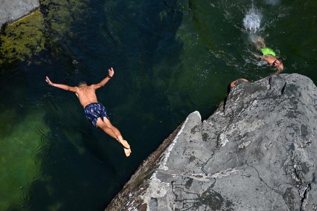 (260731) -- SKOPJE, July 31, 2026 (Xinhua) -- A man dives at the Treska River to escape the summer heat near Skopje, North Macedonia, July 31, 2026. (Photo by Tomislav Georgiev/Xinhua)
